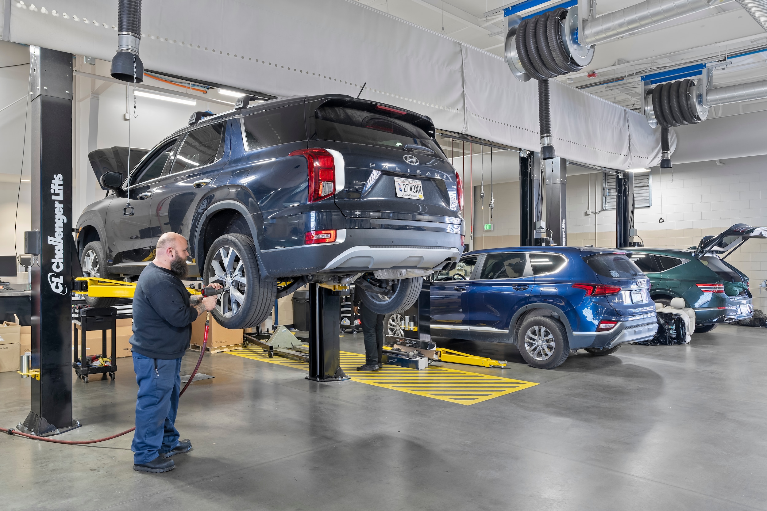  Person cheerfully signing documents.