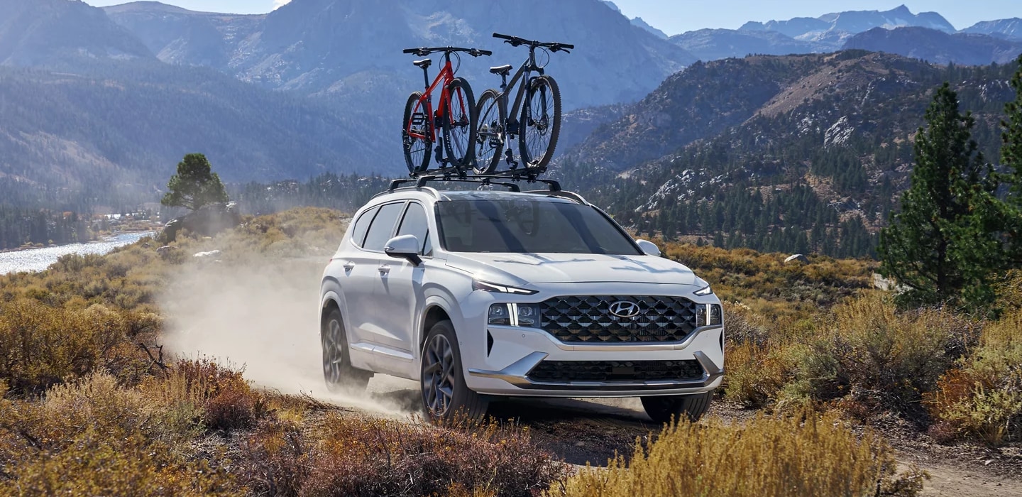 White 2023 Hyundai Santa Fe with bikes