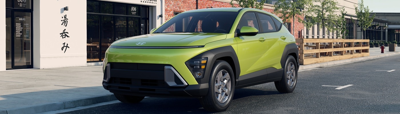 Lime Green Hyundai Kona SE parked on a city street