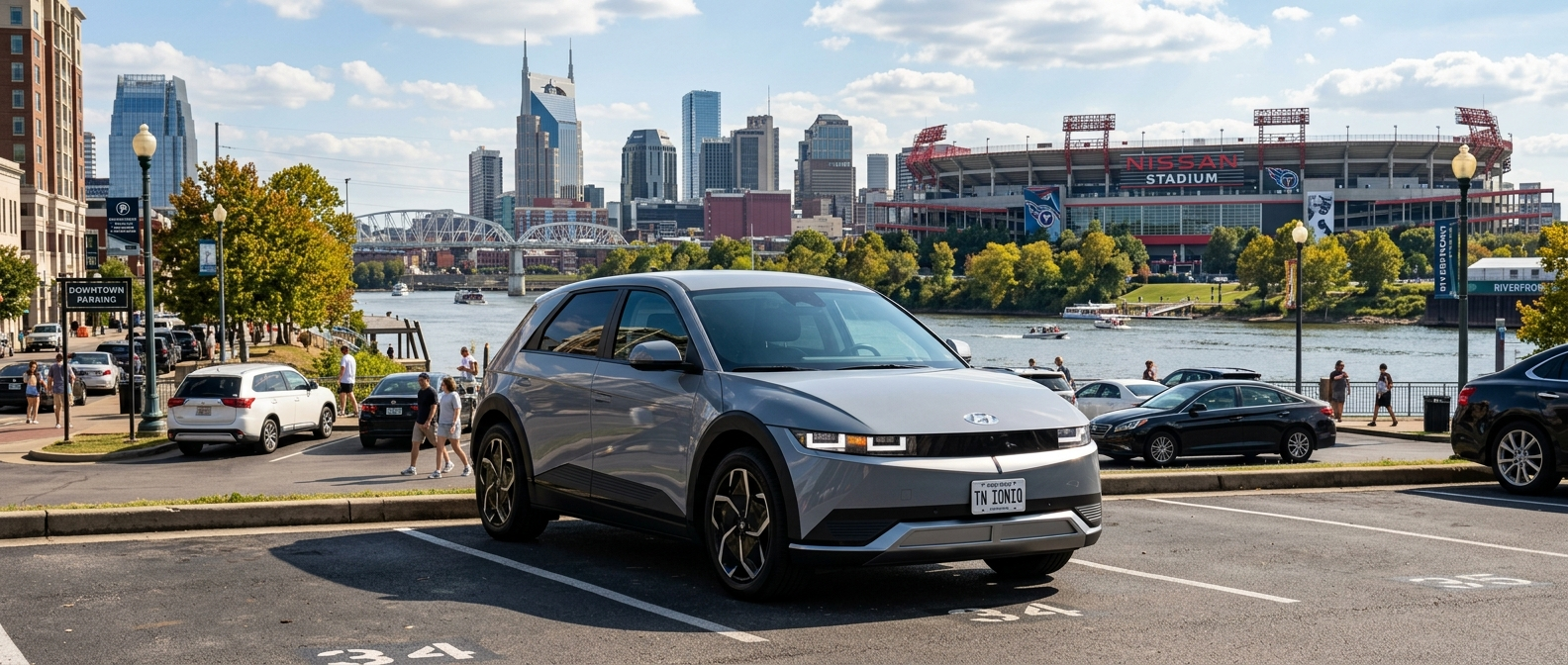 2026 Hyundai IONIQ 5 parked near Nissan Stadium in Nashville with the Cumberland River and downtown skyline in the background
