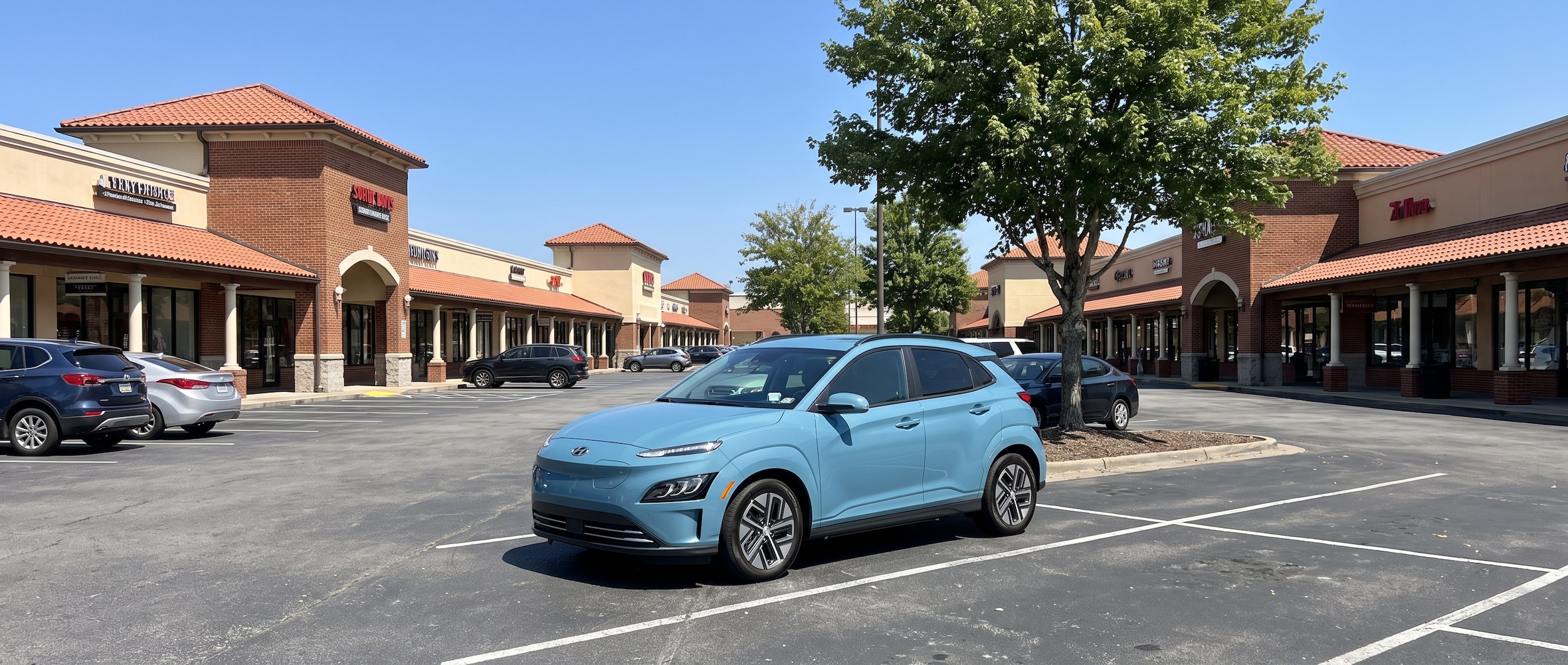 A 2026 Hyundai Kona Electric parked in a sun-drenched open-air outlet shopping center parking lot on a bright summer day, with a charging station visible in the background, Nashville, Tennessee setting