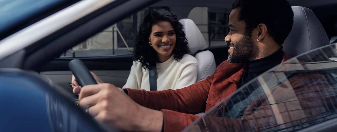 Couple driving in a 2025 Hyundai Tuscon for sale near Gastonia