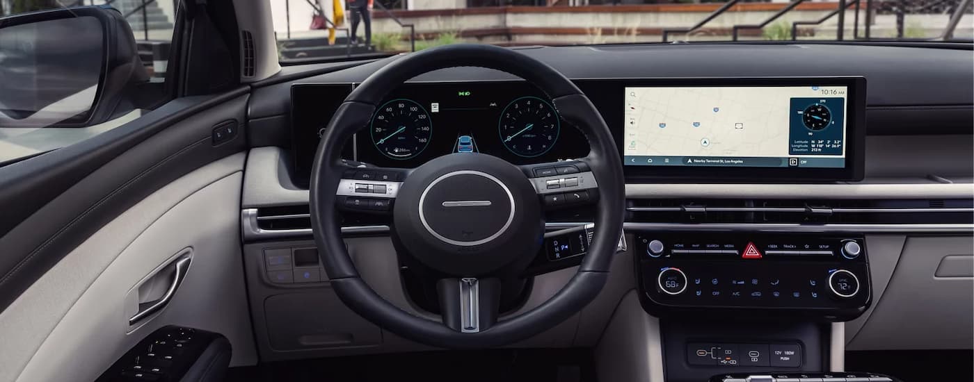 Steering wheel and infotainment screen in a 2025 Hyundai Tuscon for sale near Weddington