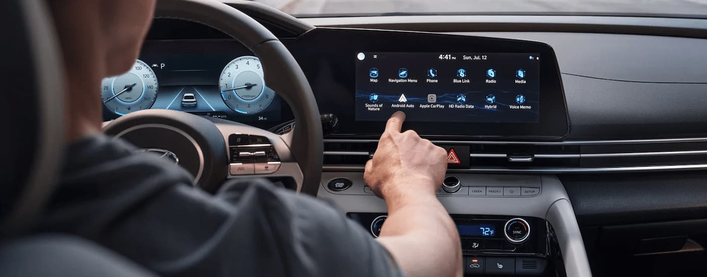 Person using infotainment screen in a 2025 Hyundai Elantra