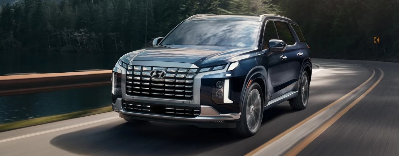 A blue 2025 Hyundai Palisade for sale in Monroe from the front.
