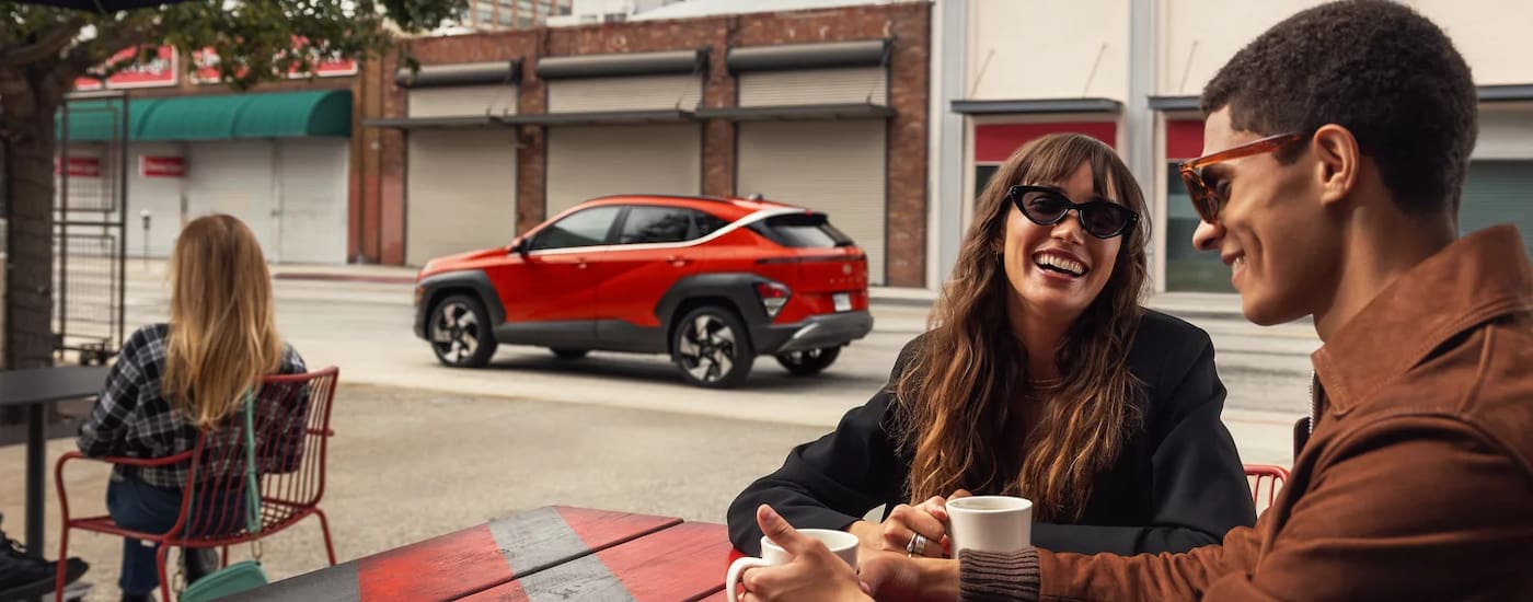 Red 2026 Hyundai Kona for sale near Indian Trail parked in a city.