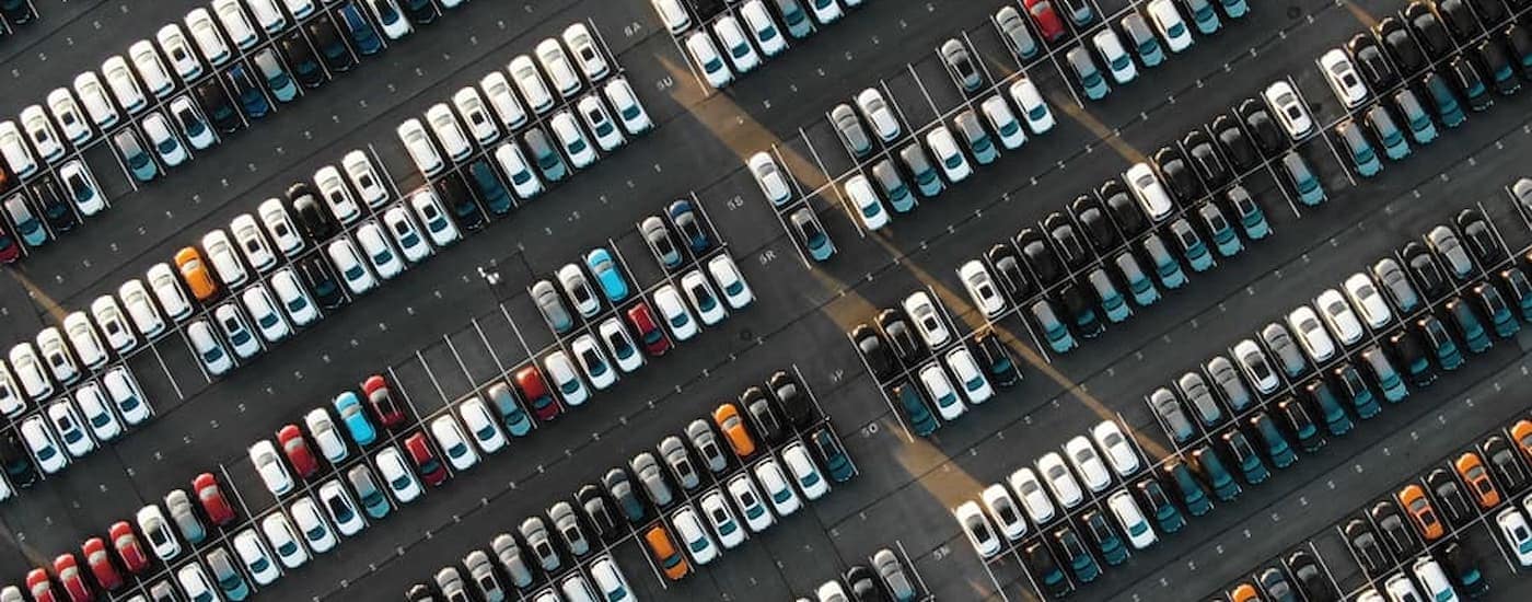 A large car lot full of vehicles.
