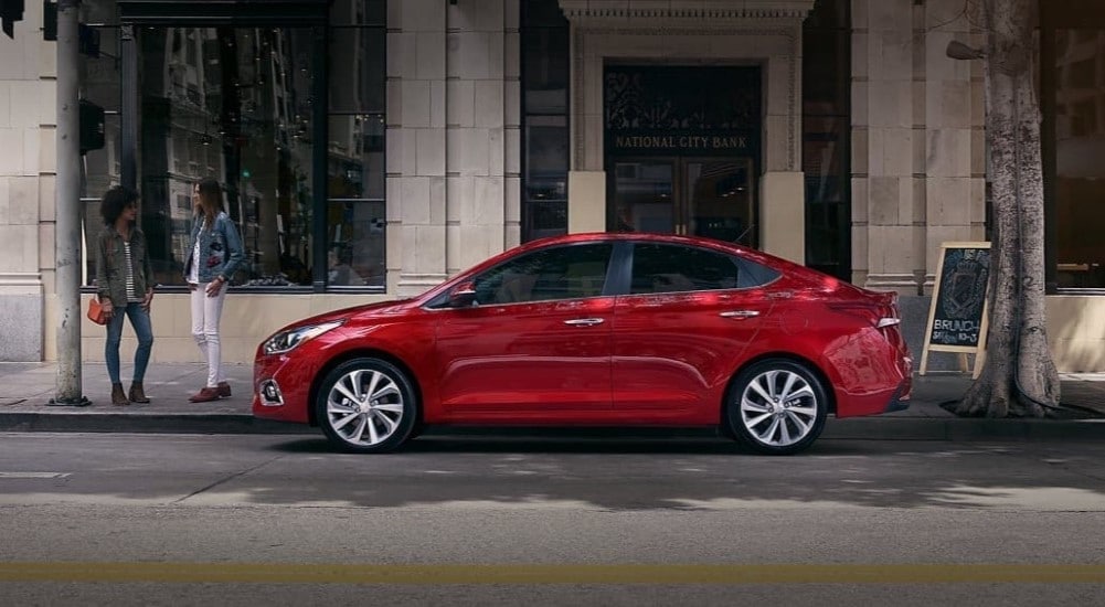 A red 2020 Hyundai Accent parked after viewing a used Hyundai dealer.