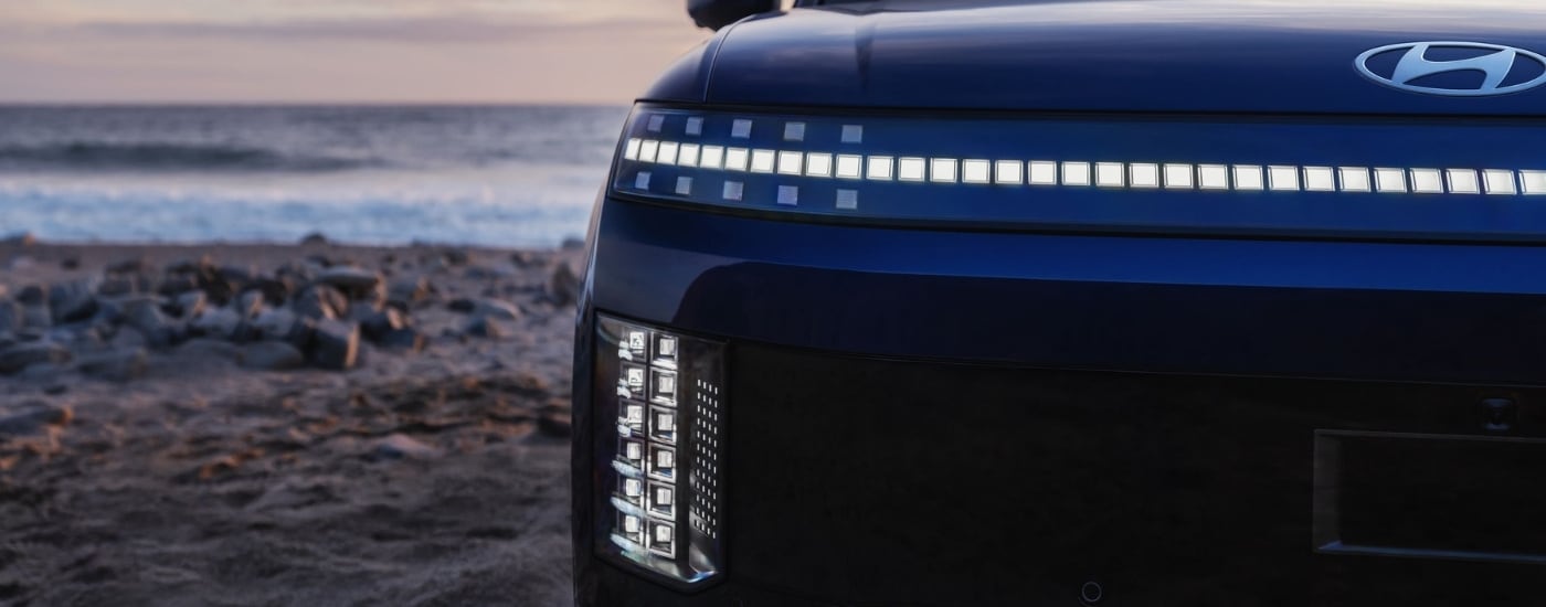 Front end details on a dark blue 2026 Hyundai IONIQ 9 Calligraphy.
