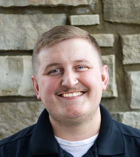 Staff member Kevin Ollanketo from ID_29f352bb2383