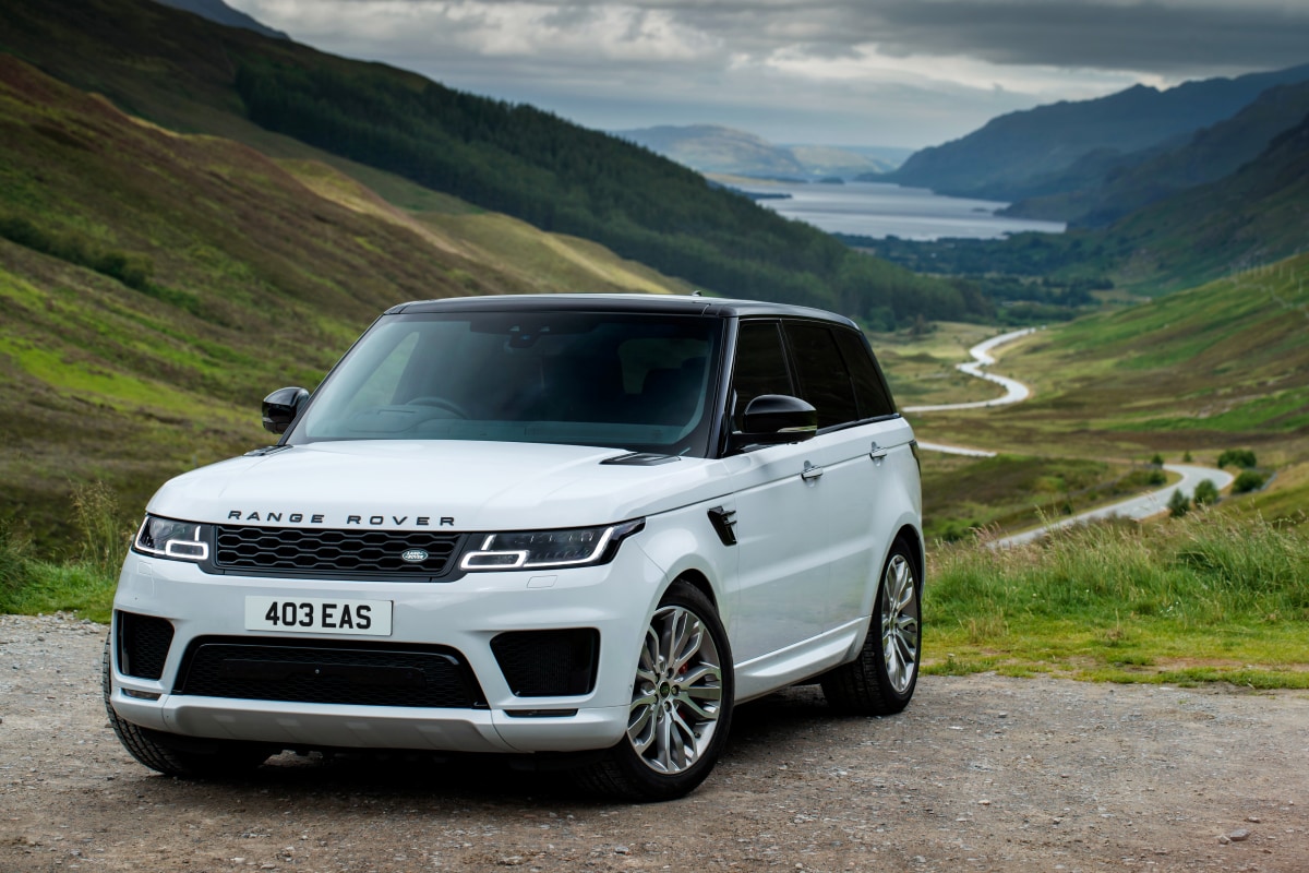 2021 Range Rover Sport parked in front of mountains and a valley with a creek