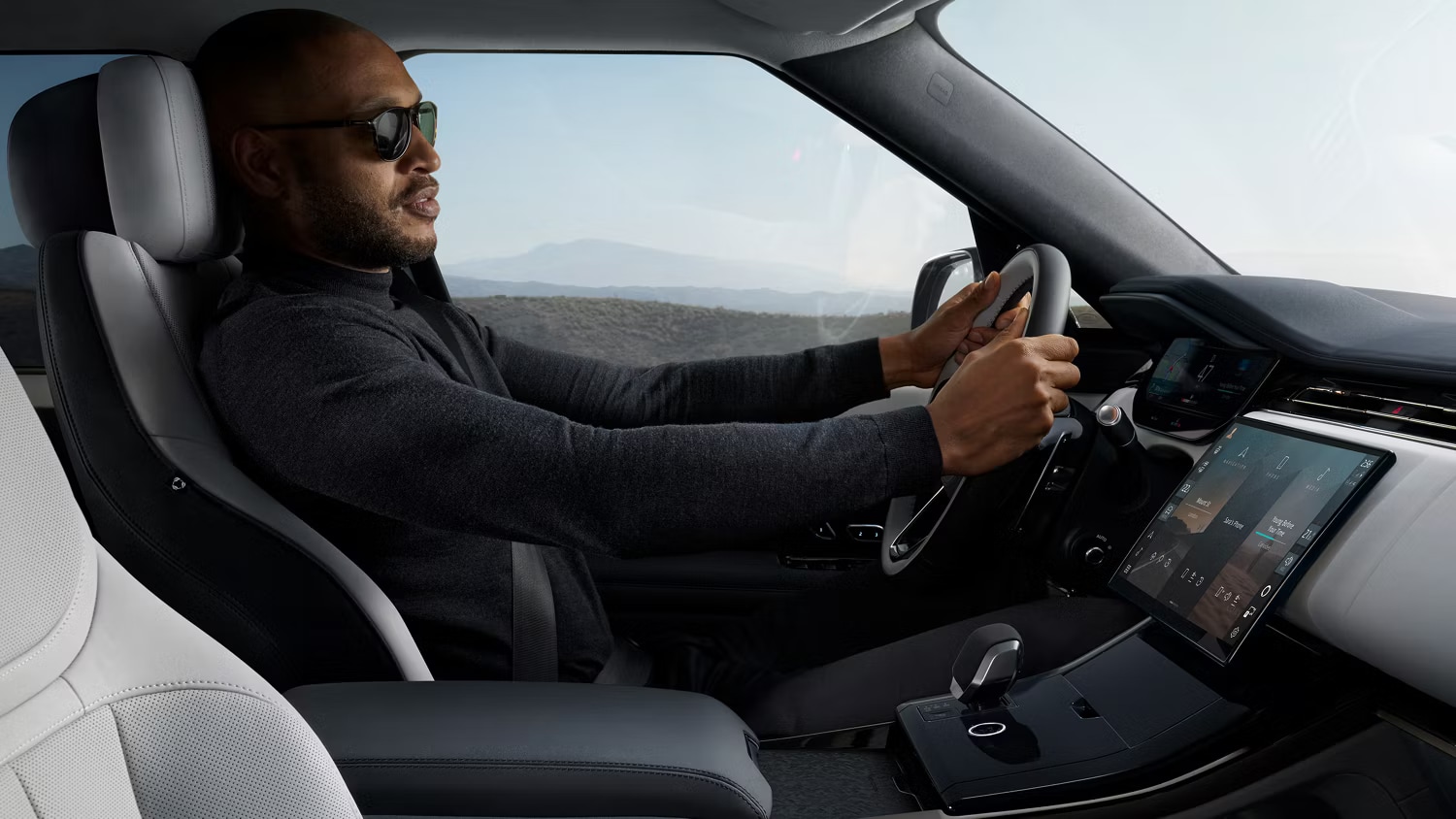Man driving a Range Rover