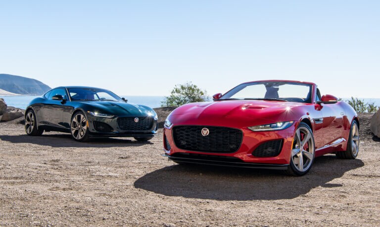 Two 2022 Jaguar F-TYPE parked on an overlook