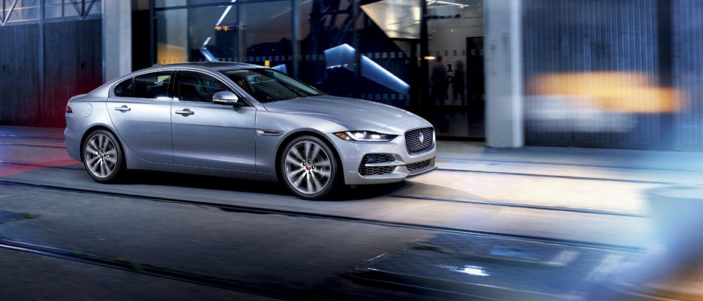 Jaguar XE driving through a city
