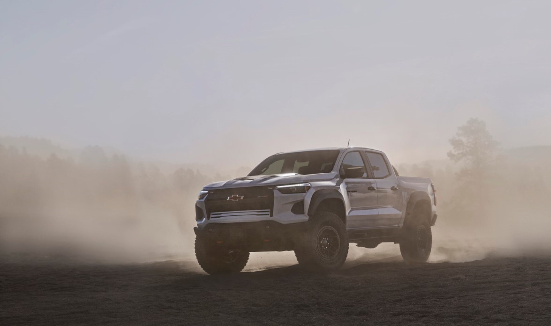A silver Chevrolet Colorado in used condition battling dust storms in Imperial Valley, on a trip to get more fertilizer for the farm
