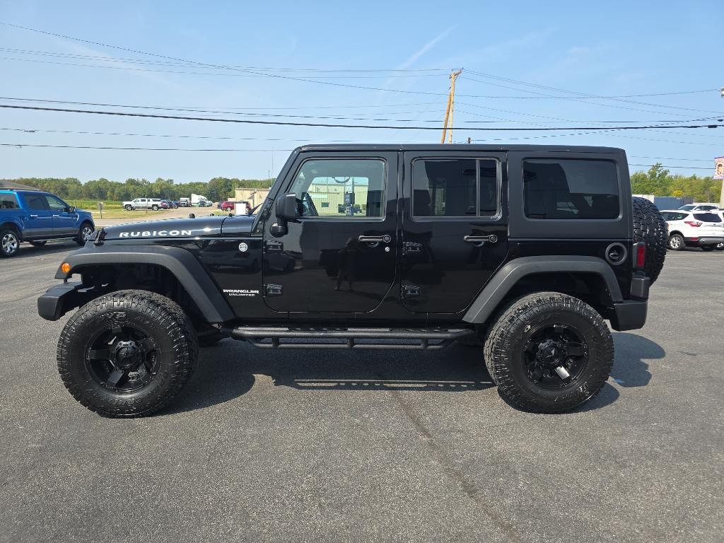 Used 2015 Jeep Wrangler Unlimited Rubicon with VIN 1C4BJWFG6FL691037 for sale in Bellefontaine, OH