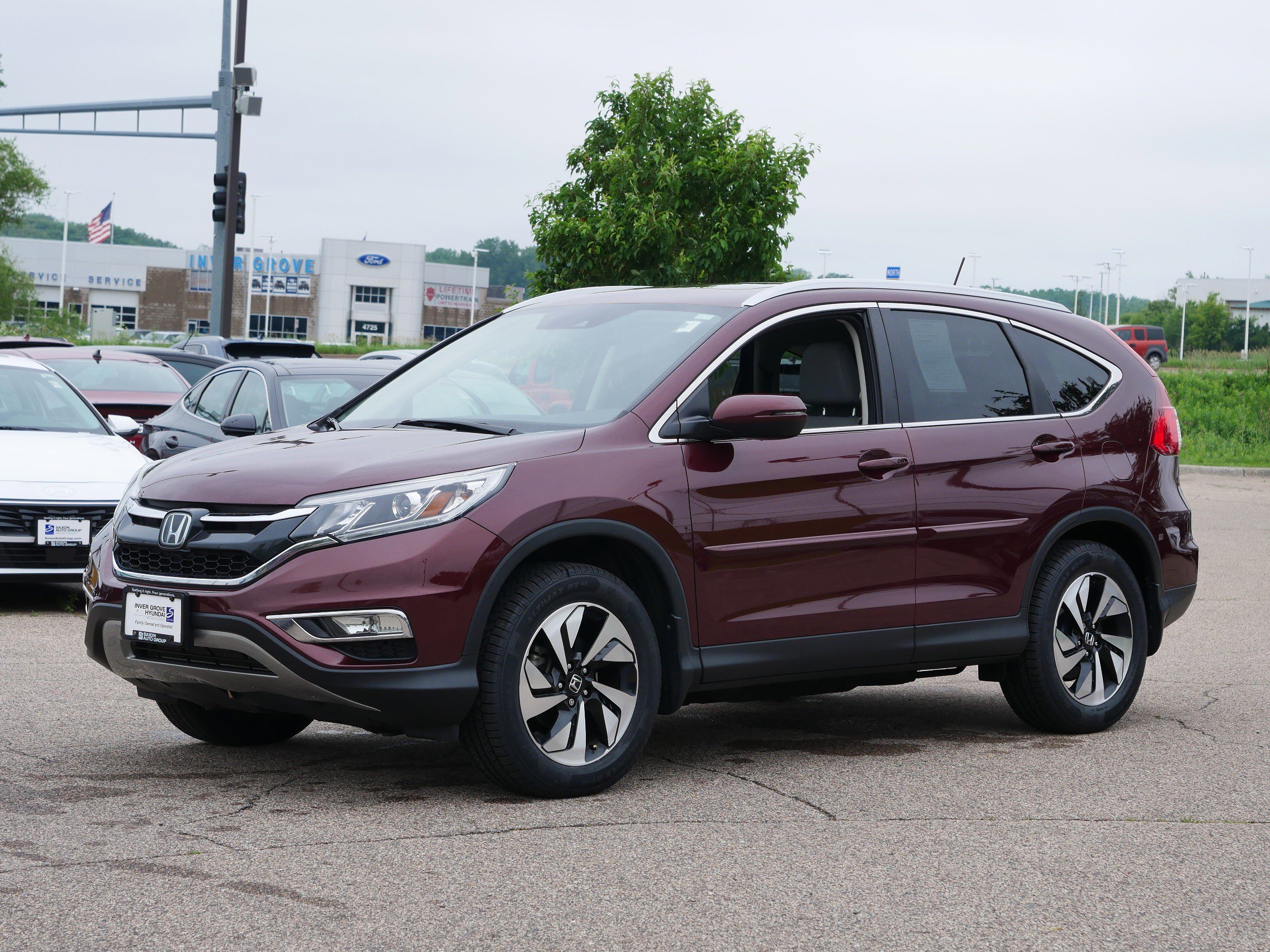 Used 2016 Honda CR-V Touring with VIN 5J6RM4H95GL018776 for sale in Inver Grove, Minnesota