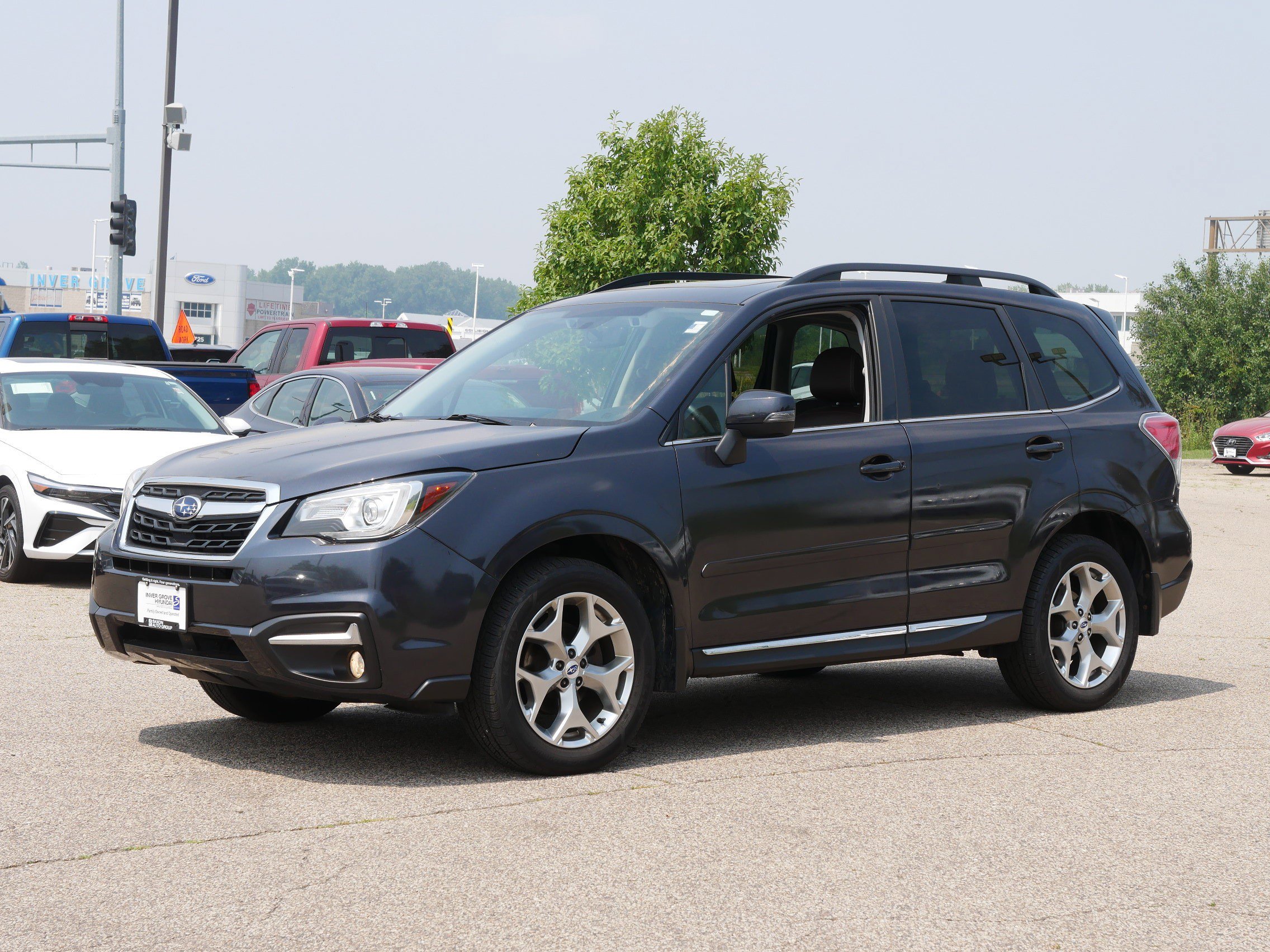 Used 2017 Subaru Forester Touring with VIN JF2SJAWC5HH522313 for sale in Inver Grove Heights, Minnesota