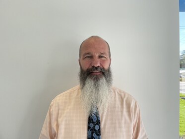 Staff member Brian from ID_828623