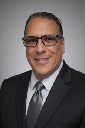 Staff member Emilio Rodriguez from ID_046a4e313b8b