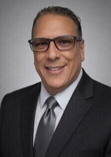 Staff member Emilio Rodriguez from ID_046a4e313b8b