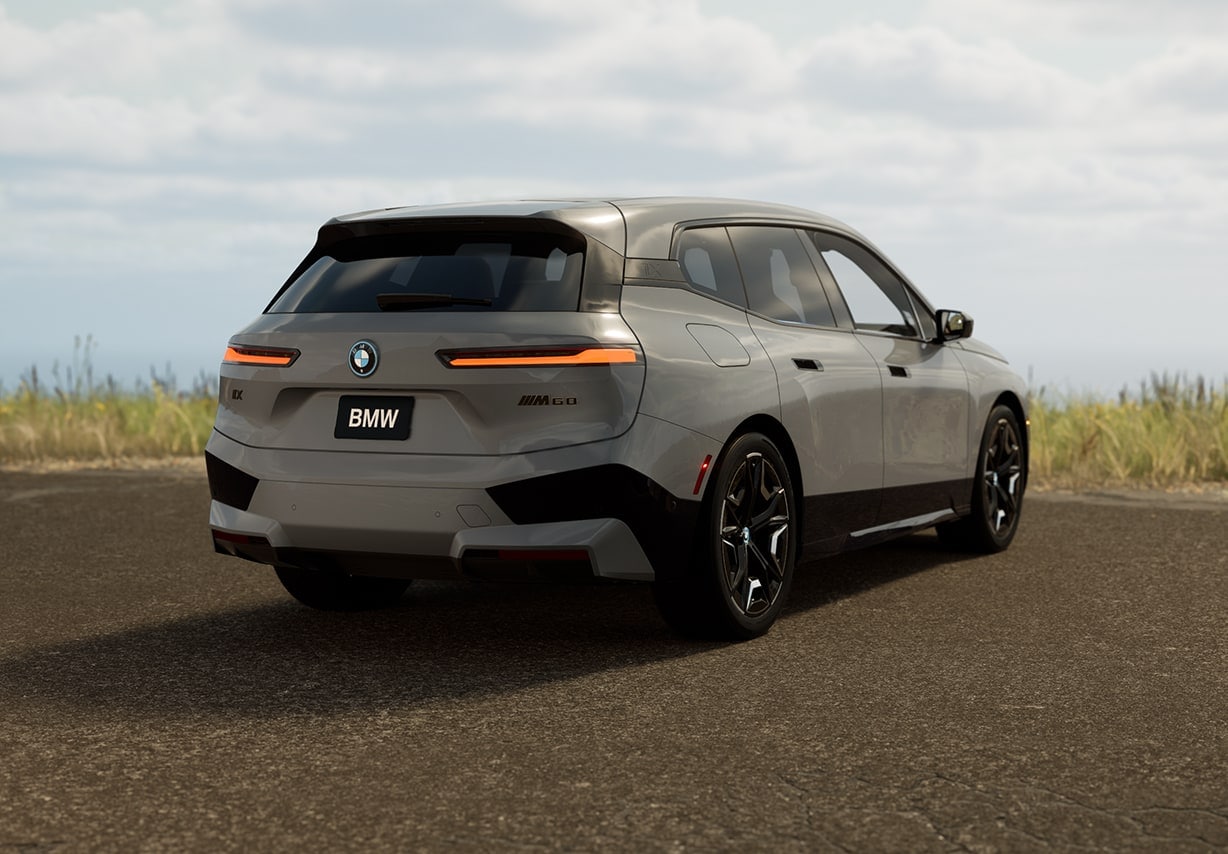 A gray 2025 BMW iX being viewed from behind.