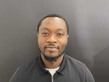 Staff member Reggie Fredericks from 335b80b0ef56