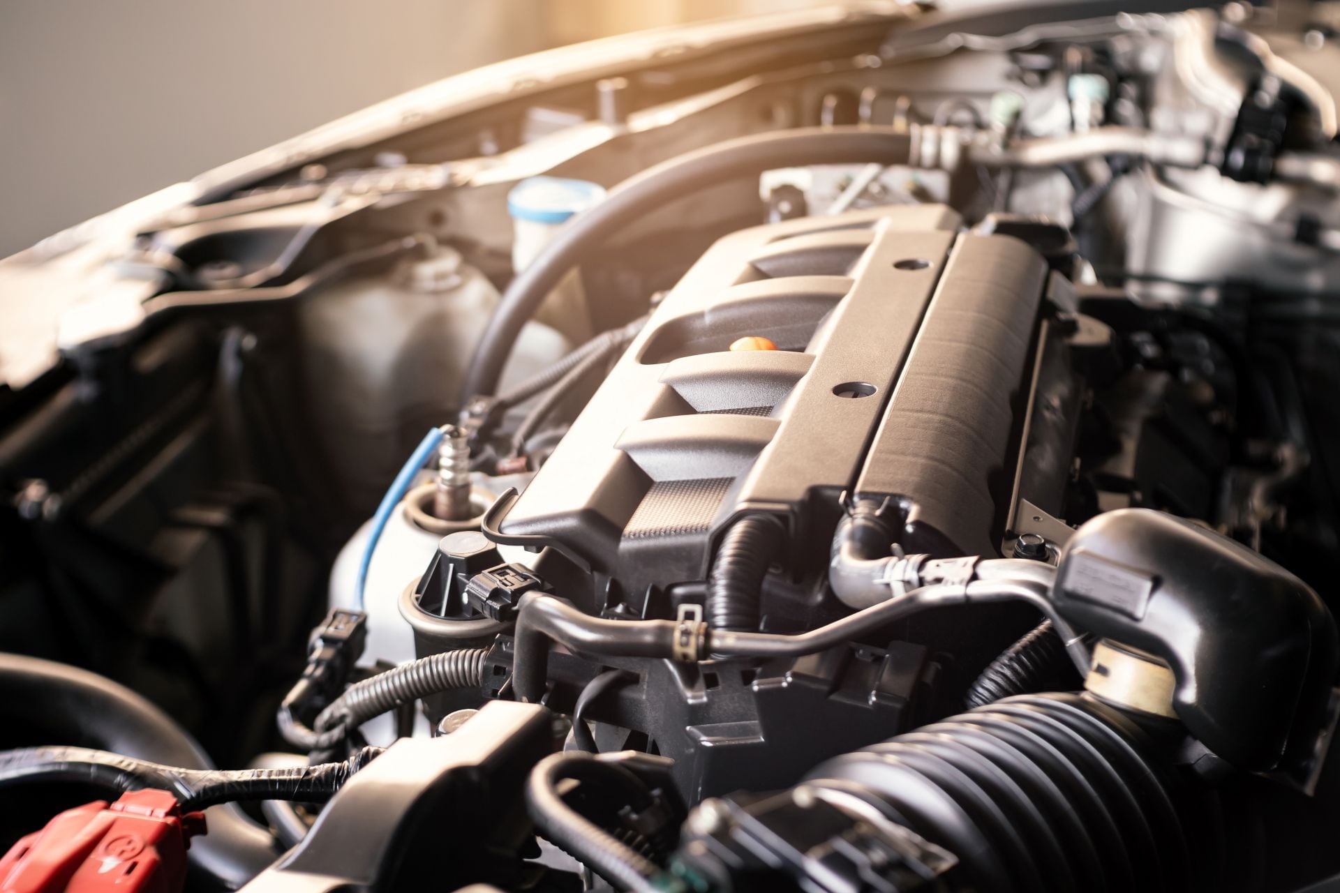 details of modern car engine with sunlight effect, shallow depth of field, diesel internal combustion engine vehicle