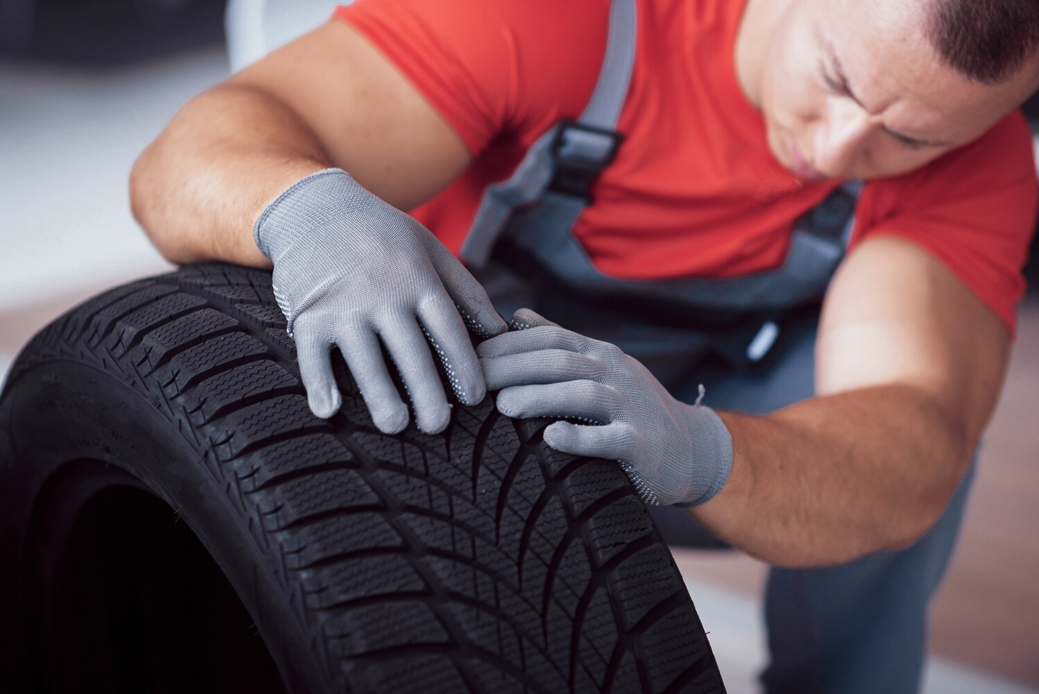 What different tire options are available at Genesis of York in York | Service technician inspecting a brand new tire
