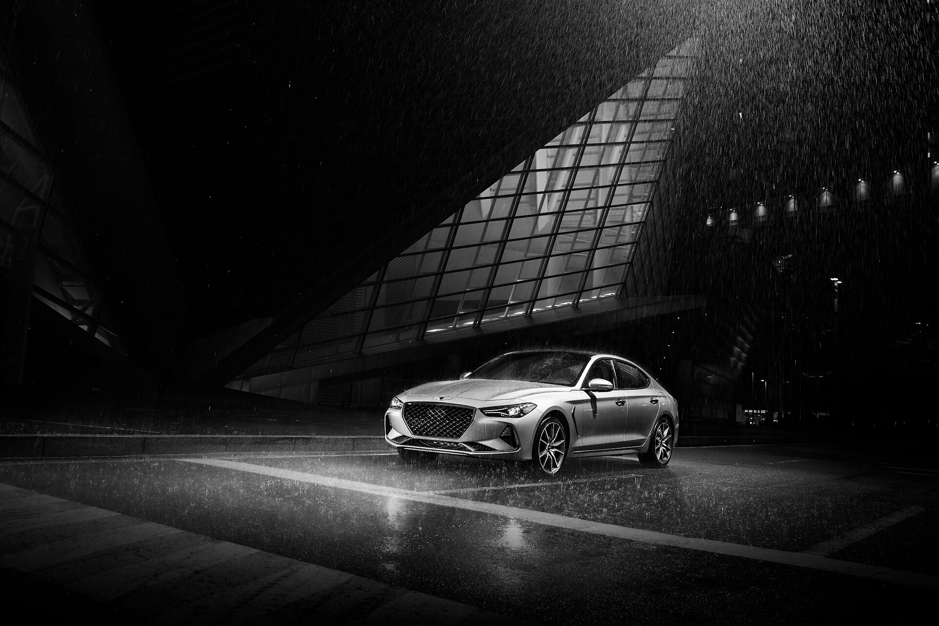 Can I trade in my leased vehicle at Genesis of York | 2020 Genesis G70 parked at night in the rain