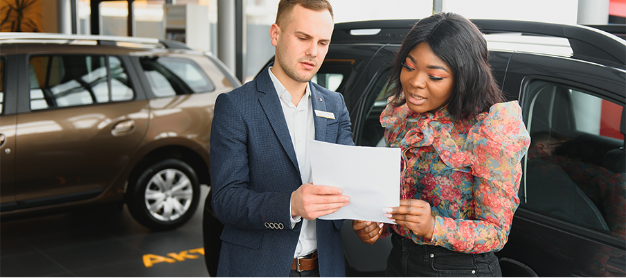 Leasing versus Buying a Hyundai at Jack Giambalvo Hyundai in York, PA | woman talking to a sales person about leasing a vehicle while at the dealership 