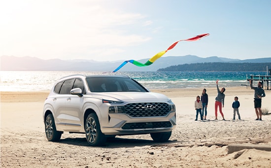 Model Features of the 2022 Hyundai Santa Fe at Jack Giambalvo Hyundai | Santa Fe parked at beach with kites