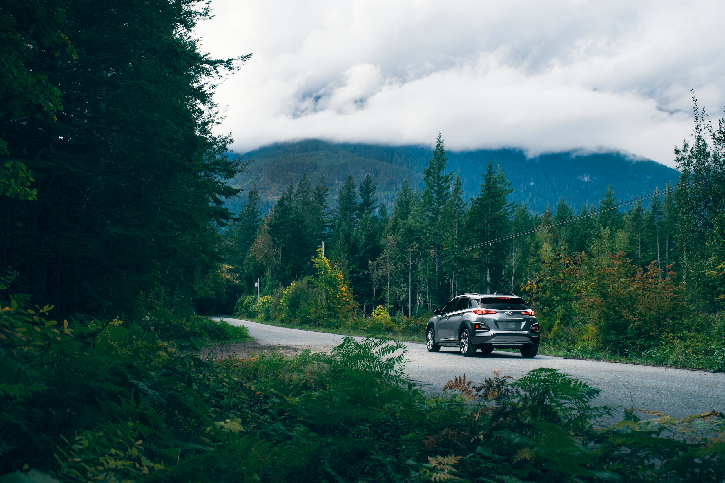 Jack Giambalvo Hyundai is a Hyundai Dealership in York near Red Lion, PA | 2020 Hyundai Kona driving on forest road