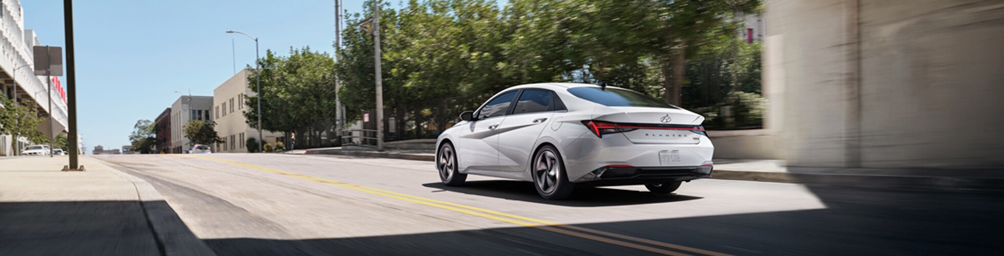 High Cost of Replacing a Car Key | Jack Giambalvo Hyundai | The 2021 Hyundai Elantra Hybrid Driving Away Down a City Street