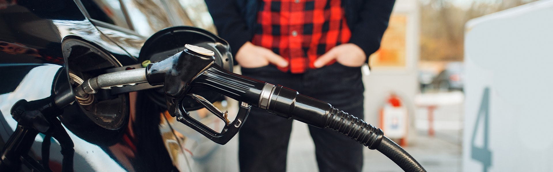 What Type of Gas is Best for My Car? At Jack Giambalvo Hyundai in York | Man Standing Next to Car Pumping Gas at Gas Station