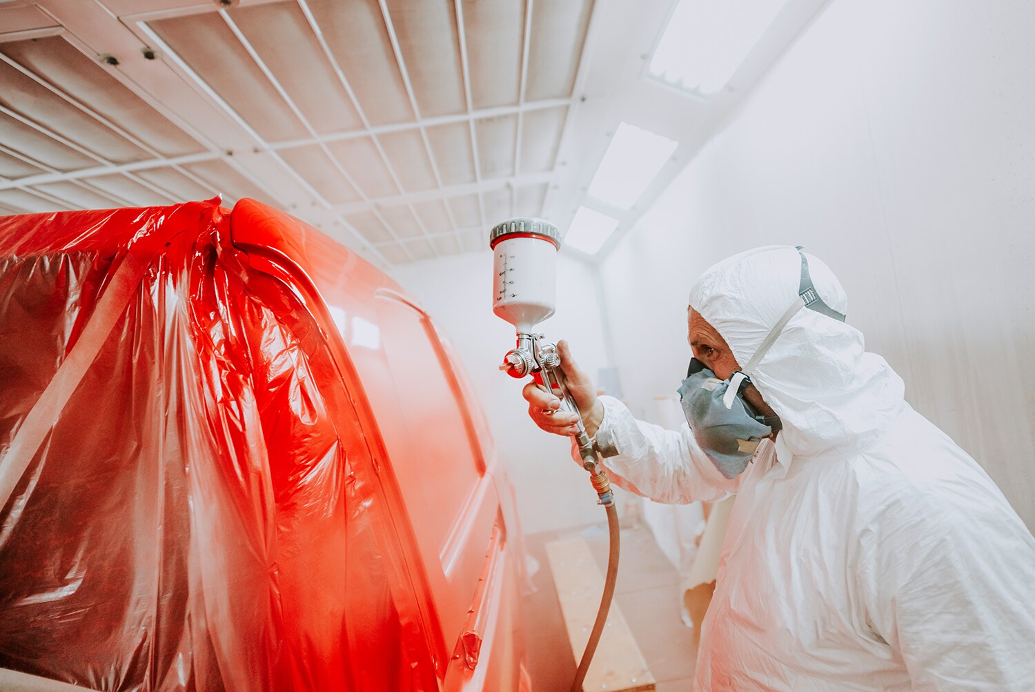 Hyundai Collision Center at Jack Giambalvo Hyundai in York | Deatailer painting car a bright red color