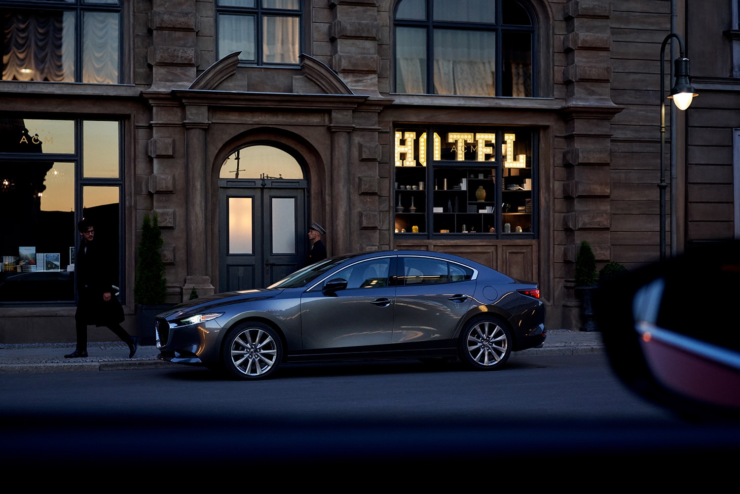 Jack Giambalvo Mazda is a Car Dealership in Valley View, PA | 2020 Mazda3 parked outside of hotel