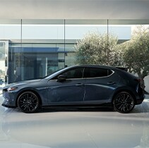 Model Features of the 2021 Mazda3 at Jack Giambalvo Mazda | Mazda3 parked in home