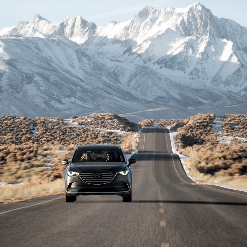 Jack Giambalvo Mazda is a Car Dealership near Lancaster PA | 2020 Mazda CX-3 driving on highway with mountains in background