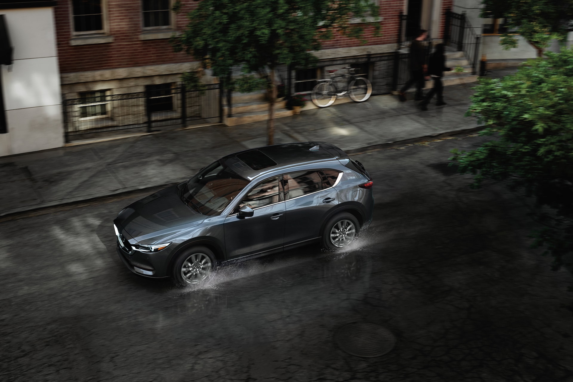 Jack Giambalvo Mazda is a Car Dealership in York PA | 2020 Mazda CX-5 driving down rainy street