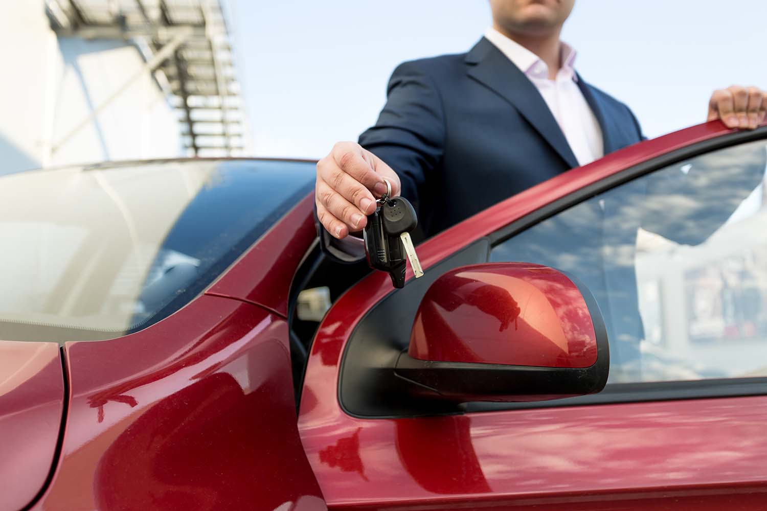 Leasing versus Buying a Mazda at Jack Giambalvo Mazda in York, PA | Close up shot of person showing keys to his new vehicle
