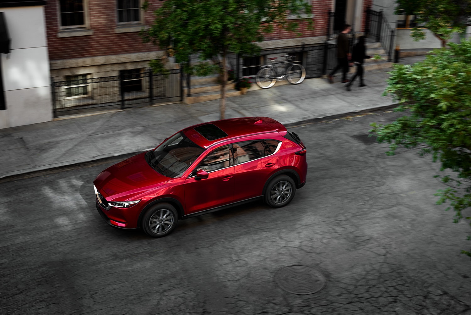 the 2021 Mazda CX-5 versus the 2021 Ford Escape at Jack Giambalvo Mazda of York | 2021 Mazda CX-5 driving downtown