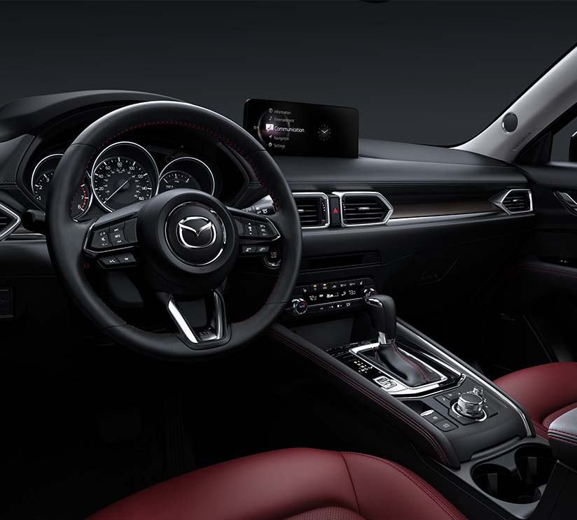 Model Features of the 2021 Mazda CX-5 at Jack Giambalvo Mazda | Interior from Driver's Perspective Showing off Technology in Dashboard & Center Console in the 2021 Mazda CX-5