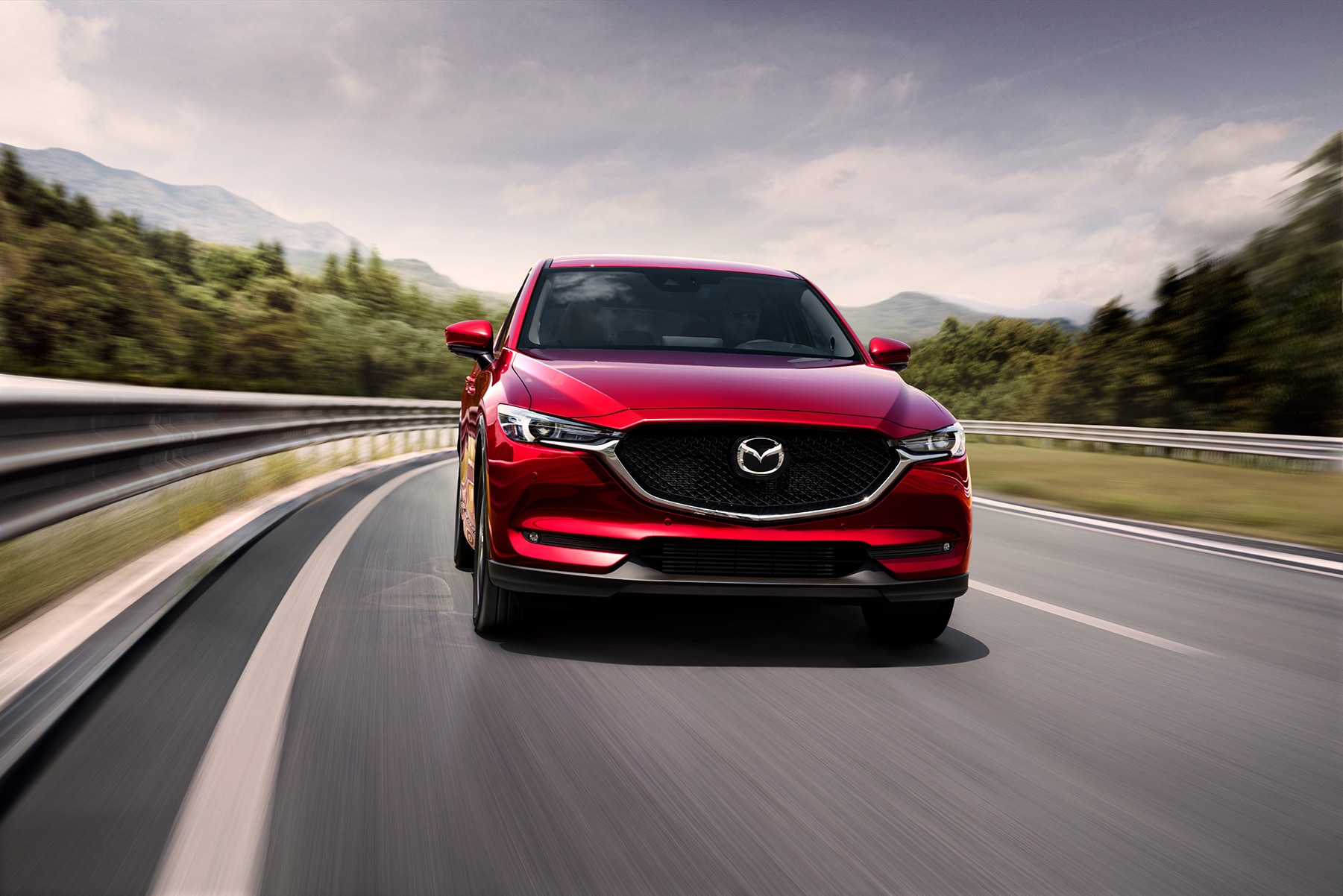 Can I trade in my leased vehicle at Jack Giambalvo Mazda in York | 2021 Mazda CX-5 driving down backroad
