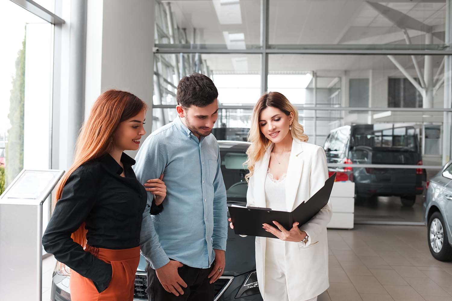 Leasing versus Buying a Mazda at Jack Giambalvo Mazda in York, PA | Mazda sales associate helping customers decide between buying or leasing their next vehicle