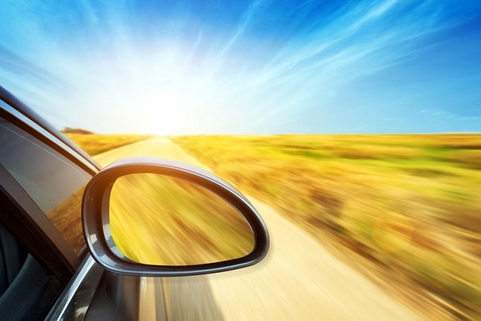 Car_Driving_On_Deserted_Road_Window_View.jpg Road with Sky Background