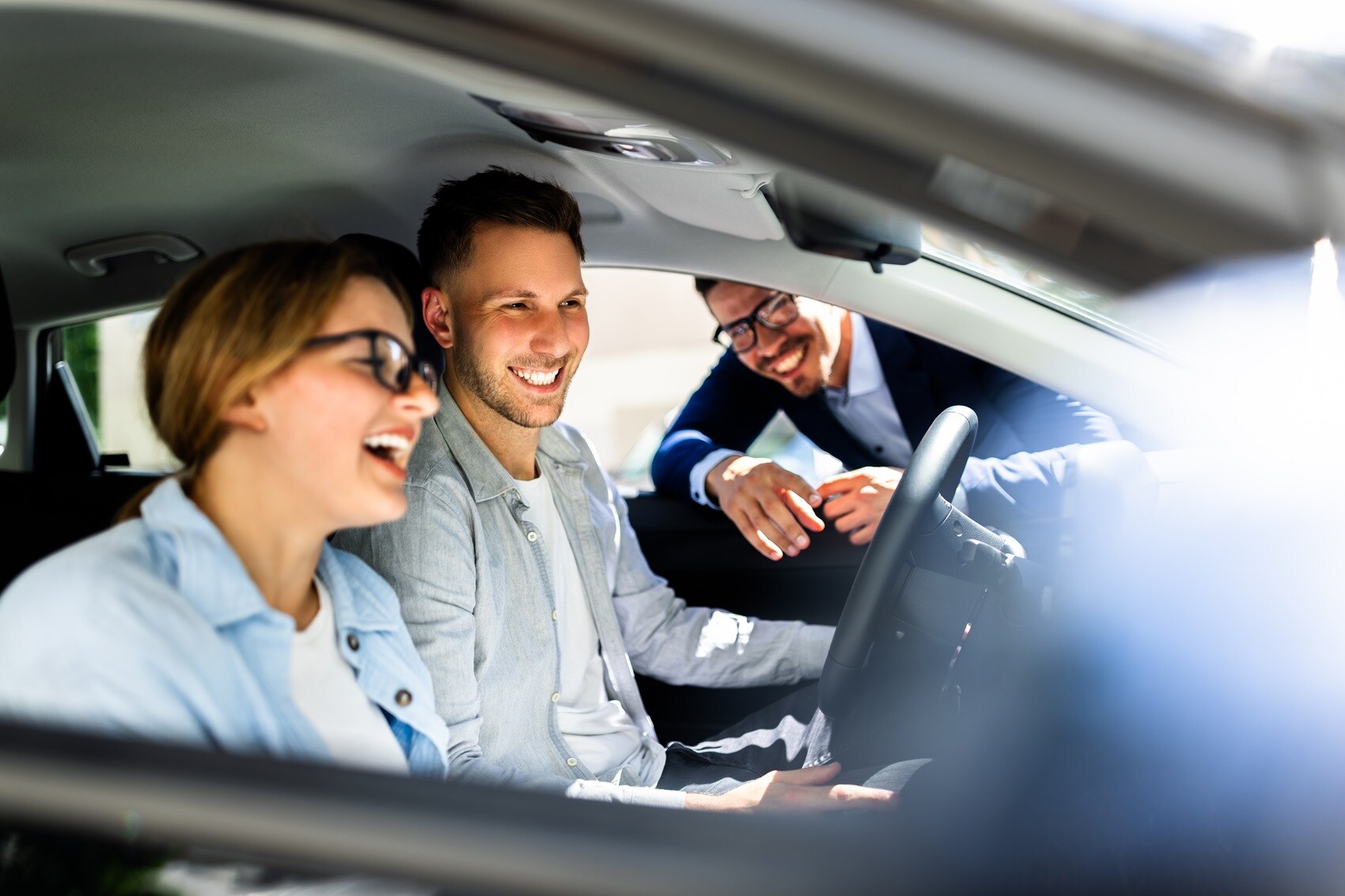 Couple Checking Out Interior of New Acura