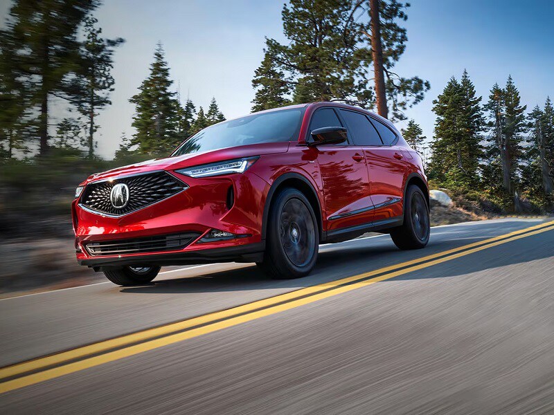 New Red Acura SUV Driving on the Road
