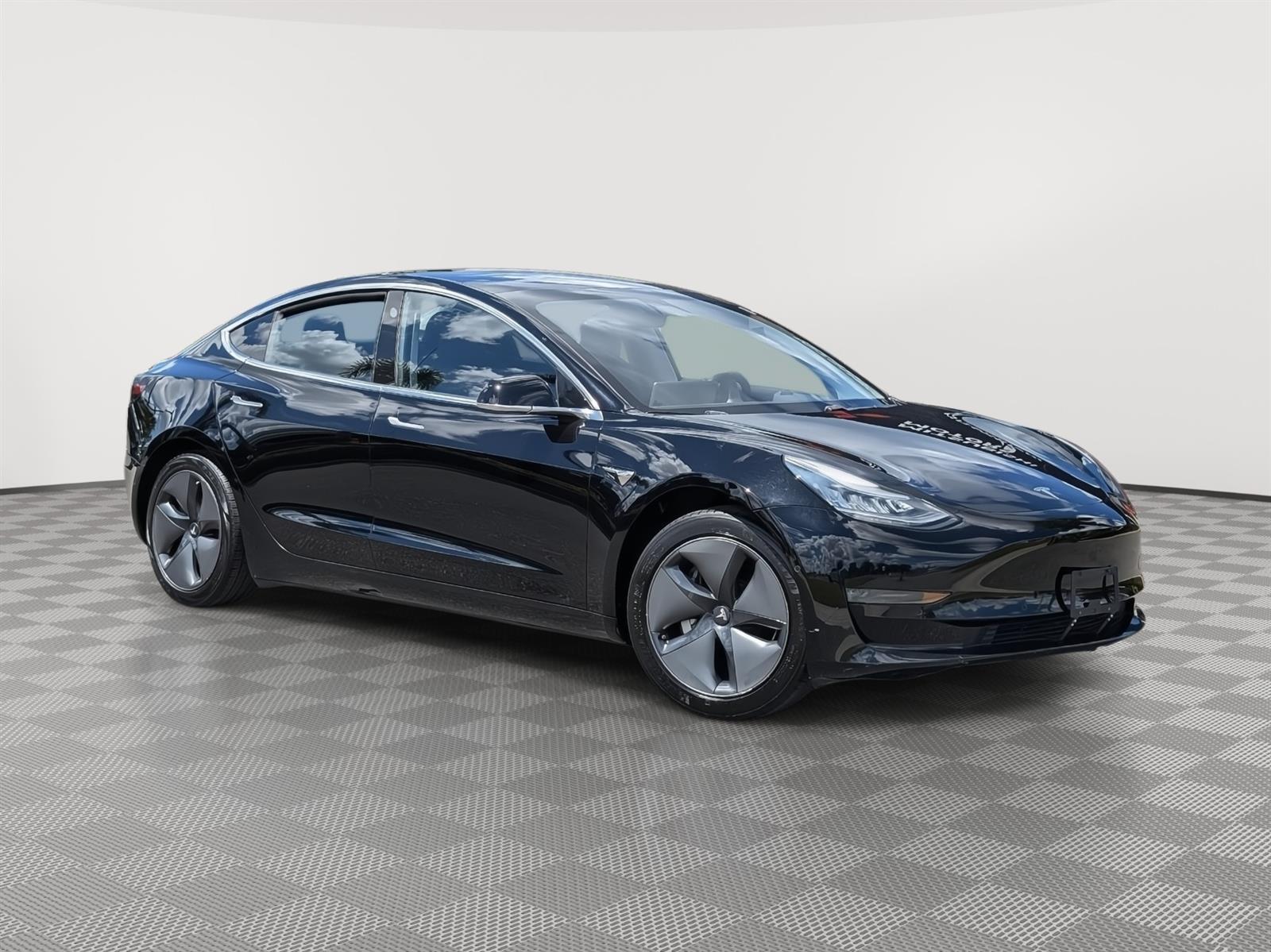 Used 2019 Tesla Model 3 Mid Range with VIN 5YJ3E1EA9KF337597 for sale in New Port Richey, FL