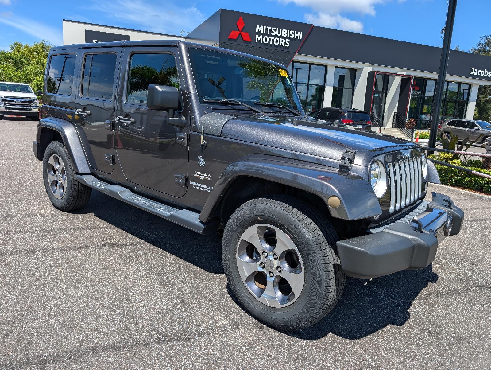 Used 2016 Jeep Wrangler Unlimited Sahara with VIN 1C4BJWEG6GL293331 for sale in New Port Richey, FL